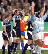 7 October 2007; Argentina prop Omar Hasan celebrates as Scotland captain Jason White holds his head as the whistle is blown for full time. Rugby World Cup Quarter Final, Scotland v Argentina, Stade de France, St.Denis, Paris, France. Picture credit; David Gibson / Sportsfile