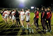 24 January 2015; The  Tyrone squad shake hands with each other as the McKenna cup sits on the ground. McKenna Cup Final, Tyrone v Cavan, Athletic Grounds, Armagh. Picture credit: Oliver McVeigh / SPORTSFILE