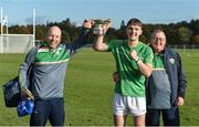 21 October 2017; Patrick Curran of Ireland with kitmen Tommy Byrne, left, and Roger Casey and the cup after the U21 Shinty International match between Ireland and Scotland at Bught Park in Inverness, Scotland. Photo by Piaras Ó Mídheach/Sportsfile