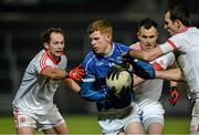 24 January 2015; Niall McDermott, Cavan, in action against Ronan McNabb, Cathal McCarron and Justin McMahon, Tyrone. McKenna Cup Final, Tyrone v Cavan, Athletic Grounds, Armagh. Picture credit: Oliver McVeigh / SPORTSFILE