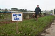 2 February 2015; Tom Mulcahy, with Rathfort James, after coursing was cancelled due to frost on Day 3 of the National Coursing Meeting 2015, Powerstown Park, Clonmel, Co. Tipperary. Picture credit: David Maher / SPORTSFILE