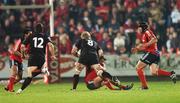 3 November 2007; Simon Cross, Edinburgh Rugby, is tackled by Ronan O'Gara, Munster. Magners League, Munster v Edinburgh Rugby, Musgrave Park, Cork. Photo by Sportsfile *** Local Caption ***