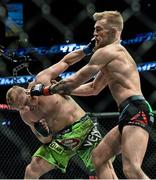 18 January 2015; Conor McGregor, right, in action against Dennis Siver. UFC Fight Night, Conor McGregor v Dennis Siver, TD Garden, Boston, Massachusetts, USA. Picture credit: Ramsey Cardy / SPORTSFILE