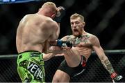 18 January 2015; Conor McGregor, right, in action against Dennis Siver. UFC Fight Night, Conor McGregor v Dennis Siver, TD Garden, Boston, Massachusetts, USA. Picture credit: Ramsey Cardy / SPORTSFILE