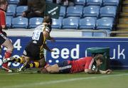 10 November 2007; Munster's Shaun Payne goes over for a try despite the tackle of Mark Van Gisbergen, London Wasps. Heineken Cup, Pool 5, Round 1, London Wasps v Munster, Ricoh Arena, Foleshill, Coventry, England. Picture credit; Matt Browne / SPORTSFILE *** Local Caption ***