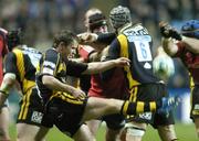 10 November 2007; Eoin Reddan, London Wasps, has his kick blocked by Alan Quinlan, Munster. Heineken Cup, Pool 5, Round 1, London Wasps v Munster, Ricoh Arena, Foleshill, Coventry, England. Picture credit; Matt Browne / SPORTSFILE *** Local Caption ***