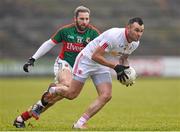 8 February 2015; Cathal McCarron, Tyrone, in action against Michael Conroy, Mayo. Allianz Football League, Division 1, Round 2, Mayo v Tyrone, Elverys MacHale Park, Castlebar, Co. Mayo. Picture credit: David Maher / SPORTSFILE