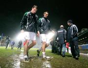 17 November 2007; Northern Ireland's Jonny Evans, left, and Gareth McAuley leave the field after the warm up in atrocious foot conditions. 2008 European Championship Qualifier, Northern Ireland v Denmark, Windsor Park, Belfast, Co. Antrim. Picture credit; Oliver McVeigh / SPORTSFILE