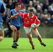 9 April 2000; Ciaran O'Sullivan of Cork is tackled by Ciaran Whelan of Dublin during the Church & General National Football League Division 1A match between Dublin and Cork at Parnell Park in Dublin. Photo by Brendan Moran/Sportsfile