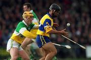 2 April 2000; David Forde of Clare is tackled by Niall Claffey of Offaly during the Church & General National Hurling League Division 1A Round 5 match between Offaly and Clare at St Brendan's Park in Birr, Offaly. Photo by Aoife Rice/Sportsfile
