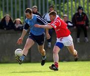 9 April 2000; Ian Robertson of Dublin in action against Donagh Wiseman of Cork during the Church & General National Football League Division 1A match between Dublin and Cork at Parnell Park in Dublin. Photo by Brendan Moran/Sportsfile