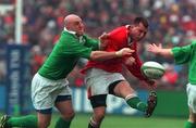 1 April 2000; Geraint Lewis of Wales is tackled by Keith Wood of Ireland during the Lloyds TSB 6 Nations match between Ireland and Wales at Lansdowne Road in Dublin. Photo by Brendan Moran/Sportsfile