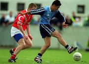9 April 2000; Jason Sherlock of Dublin is tackled by Donagh Wiseman of Cork during the Church & General National Football League Division 1A match between Dublin and Cork at Parnell Park in Dublin. Photo by Brendan Moran/Sportsfile