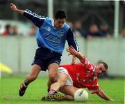 9 April 2000; Jason Sherlock of  Dublin in action against John Miskella of Cork during the Church & General National Football League Division 1A match between Dublin and Cork at Parnell Park in Dublin. Photo by Brendan Moran/Sportsfile