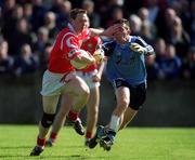 9 April 2000; Philip Clifford of Cork in action against Jonathan Magee of Dublin during the Church & General National Football League Division 1A match between Dublin and Cork at Parnell Park in Dublin. Photo by Aoife Rice/Sportsfile