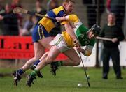2 April 2000; Joe Errity of Offaly is tackled by Kenneth Kennedy of Clare during the Church & General National Hurling League Division 1A Round 5 match between Offaly and Clare at St Brendan's Park in Birr, Offaly. Photo by Damien Eagers/Sportsfile
