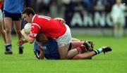 9 April 2000; Joe Kavanagh of Cork is tackled by Shane Ryan of Dublin during the Church & General National Football League Division 1A match between Dublin and Cork at Parnell Park in Dublin. Photo by Aoife Rice/Sportsfile