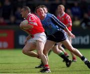 9 April 2000; John Miskella of Cork in action against Jim Gavin of Dublin during the Church & General National Football League Division 1A match between Dublin and Cork at Parnell Park in Dublin. Photo by Brendan Moran/Sportsfile