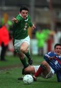 19 April 2000; Jonathan Douglas of Republic of Ireland  in action against Sébastien Roudet of France during the UEFA European Under-18 Championship Play-Off 2nd Leg match between Republic of Ireland and France at Tolka Park in Dublin. Photo by David Maher/Sportsfile