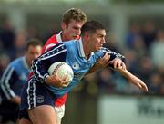 9 April 2000; Jonathan Magee of Dublin is tackled by Nicholas Murphy of Cork during the Church & General National Football League Division 1A match between Dublin and Cork at Parnell Park in Dublin. Photo by Brendan Moran/Sportsfile