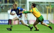 23 April 2000; Liam Hassett in action against Anthony Moyles of Meath during the Church & General National Football League Division 1 Semi-Final match between Kerry and Meath at Semple Stadium in Thurles, Tipperary. Photo by Brendan Moran/Sportsfile