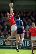 9 April 2000; Nicholas Murphy of Cork in action against Jason Ward of Dublin during the Church & General National Football League Division 1A match between Dublin and Cork at Parnell Park in Dublin. Photo by Brendan Moran/Sportsfile