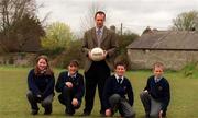19 April 2000; Offaly football manager and Vice Principal of St Patrick's Community College Padraig Nolan pictured with pupils at the college in Naas, Kildare. Photo by Damien Eagers/Sportsfile
