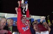 7 April 2000; Pat Scully of Shelbourne lifts the trophy following the Eircom League Premier Division match between Waterford United and Shelbourne at Regional Sports Centre in Waterford. Photo by David Maher/Sportsfile