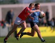 9 April 2000; Paul Curran of Dublin is tackled by Ronan McCarthy of Cork during the Church & General National Football League Division 1A match between Dublin and Cork at Parnell Park in Dublin. Photo by Brendan Moran/Sportsfile