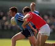 9 April 2000; Peadar Andrews of Dublin is tackled by Ronan McCarthy of Cork during the Church & General National Football League Division 1A match between Dublin and Cork at Parnell Park in Dublin. Photo by Brendan Moran/Sportsfile