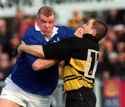 26 February 2000; Victor Costello of St Mary's is tackled by Leo Buckley of Young Munster during the AIB League Division 1 match between St Mary's and Young Munster at Templeville Road in Dublin. Photo by Matt Browne/Sportsfile