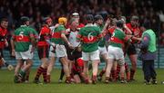 18 November 2007; Referee Ambrose Heagney, Clare, tries to restore calm as both sets of players tussle during the second half. AIB Munster Senior Hurling Club Championship Semi-Final, Adare, Limerick v Loughmore-Castleiney, Tipperary, Gaelic Grounds, Limerick. Picture credit; Stephen McCarthy / SPORTSFILE