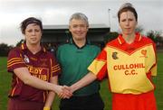 18 November 2007; Captain Michelle Murray, Keady, Armagh, shakes hands before the match with vice-captain Louise Mahony, Harps, Laois, alongside referee Cathal Egan, Cork. All-Ireland Junior Camogie Club Championship Final, Keady, Armagh v Harps, Laois, Stabannon Parnells, Stabannon, Co. Louth. Picture credit: Caroline Quinn / SPORTSFILE  *** Local Caption ***