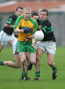 25 November 2007; Alan Cronin, Nemo Rangers, in action against Patrick Fox, Ballylanders. AIB Munster Senior Club Football Championship Semi-Final, Ballylanders, Limerick, v Nemo Rangers, Cork. John Fitzgerald Park, Kilmallock, Co. Limerick. Picture credit; Kieran Clancy / SPORTSFILE