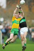 25 November 2007; Peter Morgan, Nemo Rangers, in action against Johnny Murphy, Ballylanders. AIB Munster Senior Club Football Championship Semi-Final, Ballylanders, Limerick, v Nemo Rangers, Cork. John Fitzgerald Park, Kilmallock, Co. Limerick. Picture credit; Kieran Clancy / SPORTSFILE