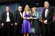 17 November 2007; Brid Stack, Cork, is presented with her Allstar award by Geraldine Giles, President, Cumann Peil na mBan, in the company of An Taoiseach Bertie Ahern, T.D, Pol O Callachoir, left, Ceannsai, TG4 and Tony Towell, O'Neills, at the 2007 O'Neills/TG4 Ladies Football All-Star Awards. Citywest Hotel, Conference, Leisure & Golf Resort, Saggart, Co. Dublin. Picture credit: Brendan Moran / SPORTSFILE  *** Local Caption ***