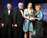 17 November 2007; Juliet Murphy, Cork, is presented with her Allstar award by Geraldine Giles, President, Cumann Peil na mBan, in the company of An Taoiseach Bertie Ahern, T.D, Pol O Callachoir, left, Ceannsai, TG4, at the 2007 O'Neills/TG4 Ladies Football All-Star Awards. Citywest Hotel, Conference, Leisure & Golf Resort, Saggart, Co. Dublin. Picture credit: Brendan Moran / SPORTSFILE  *** Local Caption ***