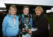 2 December 2007; Marla Candon, Foxrock Cabinteely, is presented with the cup by Geraldine Giles, President, Cumann Peil na mBan, right, Karen Ryan, Vhi Healtcare Munster. VHI Healthcare All-Ireland Ladies Junior Club Football Championship Final, West Clare Gaels, Clare v Foxrock Cabinteely, Dublin, Toomevarra, Co. Tipperary. Picture credit: Brian Lawless / SPORTSFILE