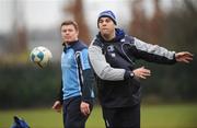 15 January 2008; Leinster head coach Michael Cheika passes as Brian O'Driscoll looks on during squad training ahead of their Heineken cup game against Leicester Tigers on Saturday. Leinster rugby squad training, Clonskeagh, Dublin. Picture credit; Brian Lawless / SPORTSFILE *** Local Caption ***