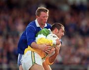 23 April 2000; Barry Malone of Offaly in action against Jason Reilly of Cavan during the Church & General National Football League Division 2 Semi-Final match between Offaly and Cavan at Cusack Park in Mullingar, Westmeath. Photo by Aoife Rice/Sportsfile