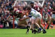 30 April 2000; Cathal Moore of Galway in action against Anthony Kirwan of Waterford during the Church & General National Hurling League Division 1 Semi-Final match between Galway and Waterford at Semple Stadium in Thurles, Tipperary. Photo by Ray McManus/Sportsfile