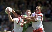 13 May 2000; Ciaran Gourley, left, and Darren O'Hanlon of Tyrone, right, in action against Brian Begley of Limerick during the All-Ireland U21 Football Championship Final match between Tyrone and Limerick at Cusack Park in Mullingar, Westmeath. Photo by Ray McManus/Sportsfile