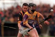9 April 2000; Chris McGrath of Wexford in action against Michael Kavanagh of Kilkenny during the Church & General National Hurling League Division 1B match between Wexford and Kilkenny at OÕKennedy Park in New Ross, Wexford. Photo by Matt Browne/Sportsfile