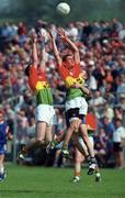 7 May 2000; Barry Sheehan of Wicklow in action against Philip Nolan and Jody Morrissey of Carlow during the Bank of Ireland Leinster Senior Football Championship Group Stage Round 1 match between Wicklow and Carlow at the Aughrim County Ground in Aughrim, Wicklow. Photo by Matt Browne/Sportsfile