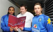 5 February 2008; Pictured is Special Olympics athlete Joe Nagle, from Islandbridge, in Dublin, showing the Special Olympics Ireland Strategy 2008-2010 to Manchester United's Anderson and Liverpool's Lucas of the Brazil International soccer squad. The strategy is available to download at www.specialolympics.ie. Croke Park, Dublin. Photo by Sportsfile