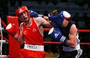 1 March 2008; Ireland’s John Joe Nevin, Cavan Boxing Club, exchanges with  Veaceslav Gojan, from Moldovia, during his 17-10 win in the 54Kg final of the AIBA European Olympic Boxing Qualifing Tournament. The 18 year old from Mullingar had qualified for the Beijing Olympics. Stadio Olympico, Pescara, Italy. Picture credit: SPORTSFILE