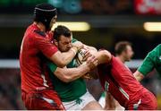 14 March 2015; Cian Healy, Ireland, is tackled by Luke Charteris, left, and Alun Wyn Jones, Wales. RBS Six Nations Rugby Championship, Wales v Ireland. Millennium Stadium, Cardiff, Wales. Picture credit: Stephen McCarthy / SPORTSFILE