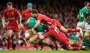14 March 2015; Robbie Henshaw, Ireland, is tackled by Mike Phillips and Rob Evans, Wales. RBS Six Nations Rugby Championship, Wales v Ireland, Millennium Stadium, Cardiff, Wales. Picture credit: Brendan Moran / SPORTSFILE