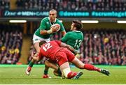 14 March 2015; Simon Zebo with the support from his Ireland team-mate Jared Payne is tackled by Jamie Roberts, Wales. RBS Six Nations Rugby Championship, Wales v Ireland. Millennium Stadium, Cardiff, Wales. Picture credit: Stephen McCarthy / SPORTSFILE