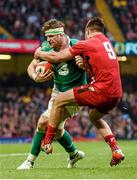 14 March 2015; Jamie Heaslip, Ireland, is tackled by Rhys Webb, Wales. RBS Six Nations Rugby Championship, Wales v Ireland. Millennium Stadium, Cardiff, Wales. Picture credit: Stephen McCarthy / SPORTSFILE